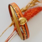 Manschettarmband i guld för kvinna Guld och orange skal